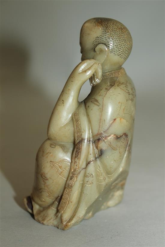 A Chinese soapstone seated figure of a luohan, 17th / 18th century, 10.5cm